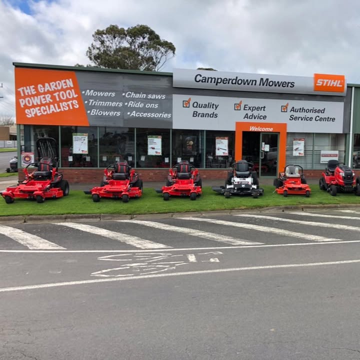 Camperdown Mowers seen from across Pike Street, six ride on mowers parked on the grass out the front